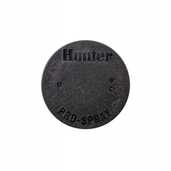 Czarny korek korpusu zraszacza Hunter PROS-04 z napisem Pro-Spray na białym tle
